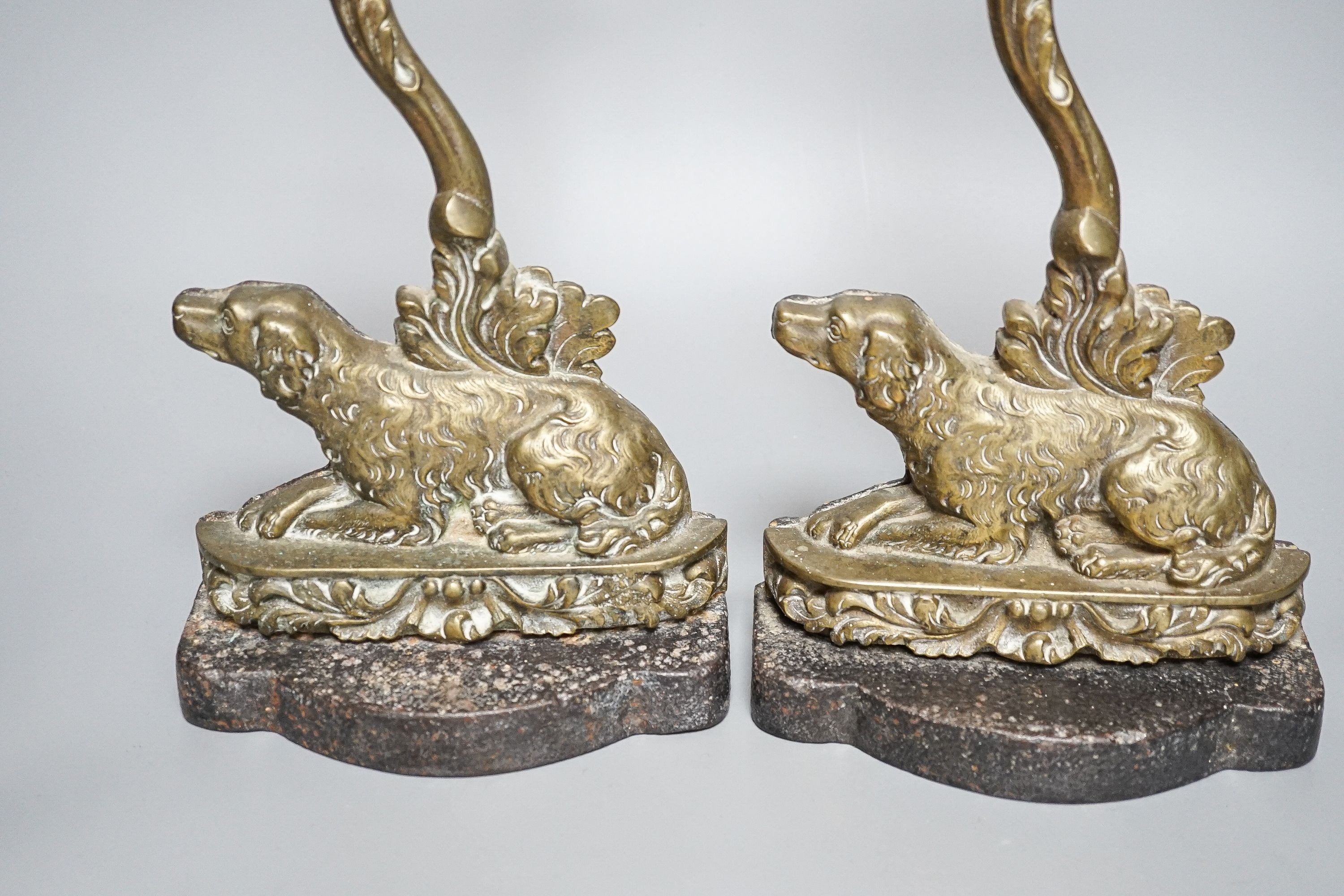 Two matching Victorian cast brass ‘spaniel’ door stops.